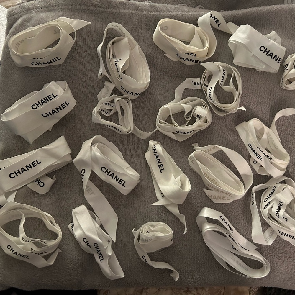 Two Chanel papers bags with camellias and 15 Chanel ribbons